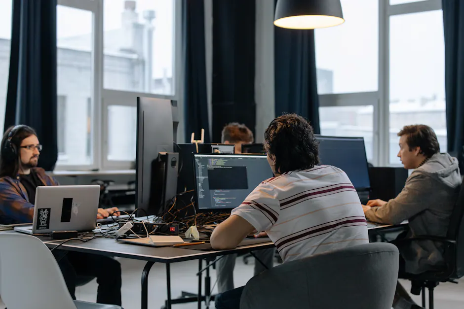 Team of developers working together on computers i